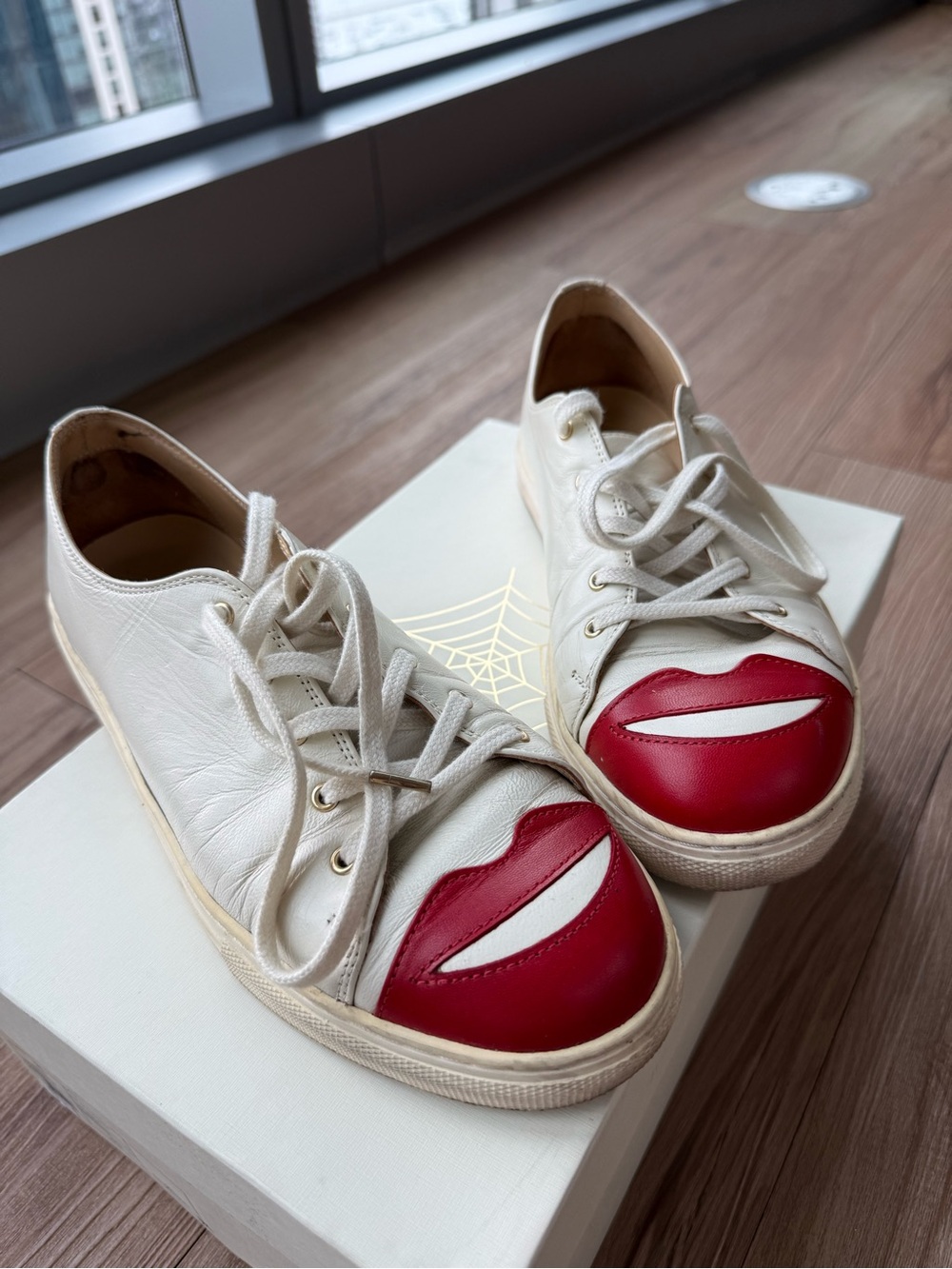 Charlotte Olympia Cream Leather Sneakers with Red Lip Toe Caps